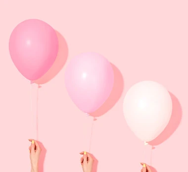 Hands Holding Balloons